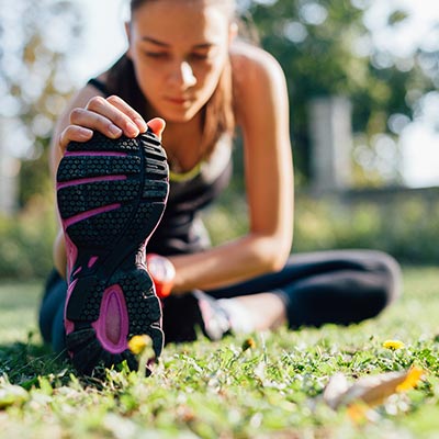 woman stretching outdoors